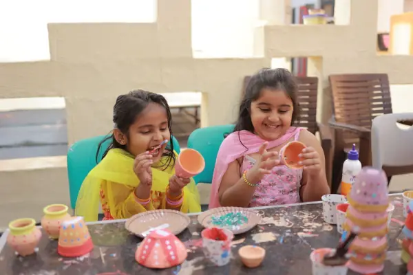 Young children doing a clay activity